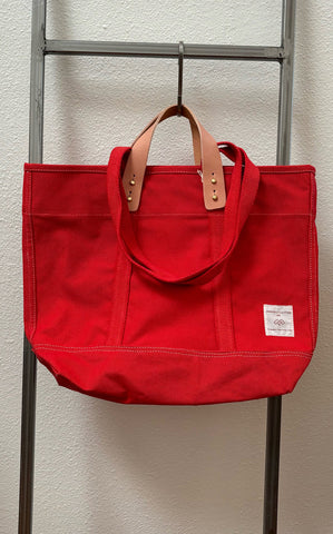 Immodest persimmon east west tote